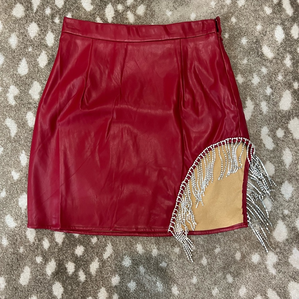 Red but a very dark red skirt. Size small. Never worn.